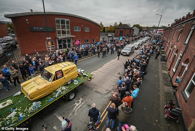 The funeral cortege of Ricky Hatton passes his boxing gym in his hometown of Hyde today