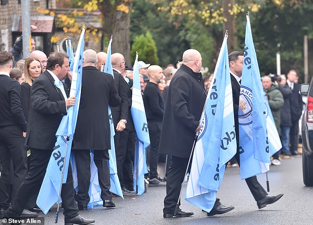 Mourners outside the Cheshire Cheese pub - Hatton's local - on Stockport Road in Hyde