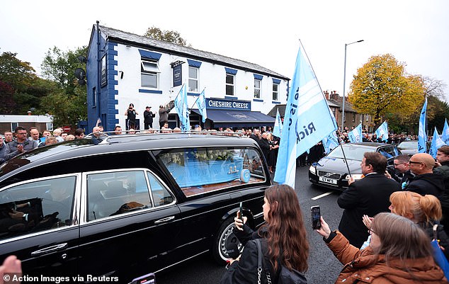 The cortege outside the Cheshire Cheese in Hyde today as Ricky Hatton's funeral takes place