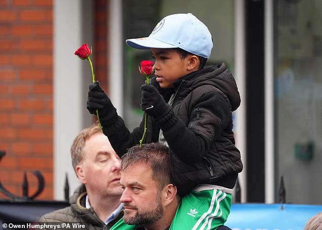 Mourners outside the Cheshire Cheese in Hyde today as Ricky Hatton's funeral takes place