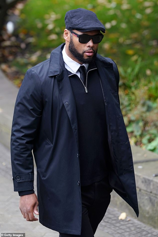 British former boxer Frazer Clarke arrives at Manchester Cathedral for the funeral today