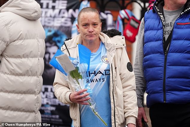 A mourner outside Hatton's Gym in Hyde ahead of the funeral procession for the boxer today
