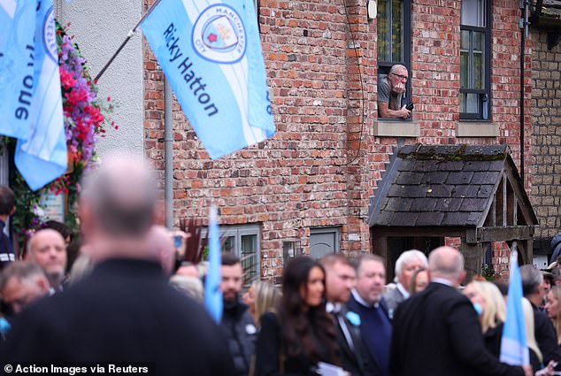 Mourners outside the Cheshire Cheese pub - Hatton's local - on Stockport Road in Hyde
