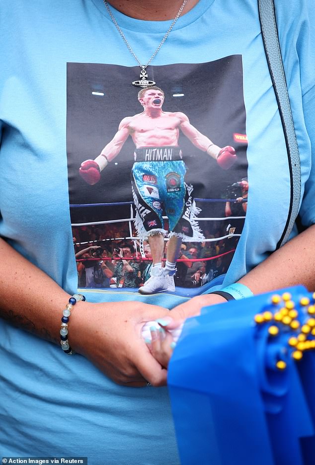 A fan with a photograph of Ricky Hatton on a shirt ahead of his funeral in Manchester today