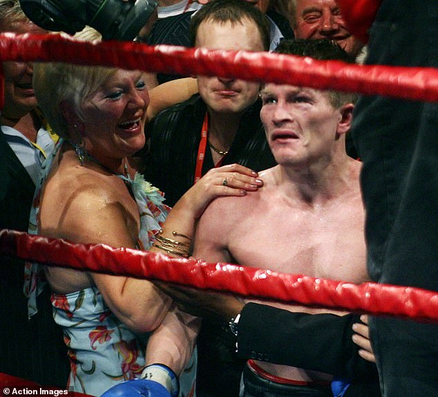 Hatton celebrates winning the light-welterweight title with mother Carol in Manchester in 2005