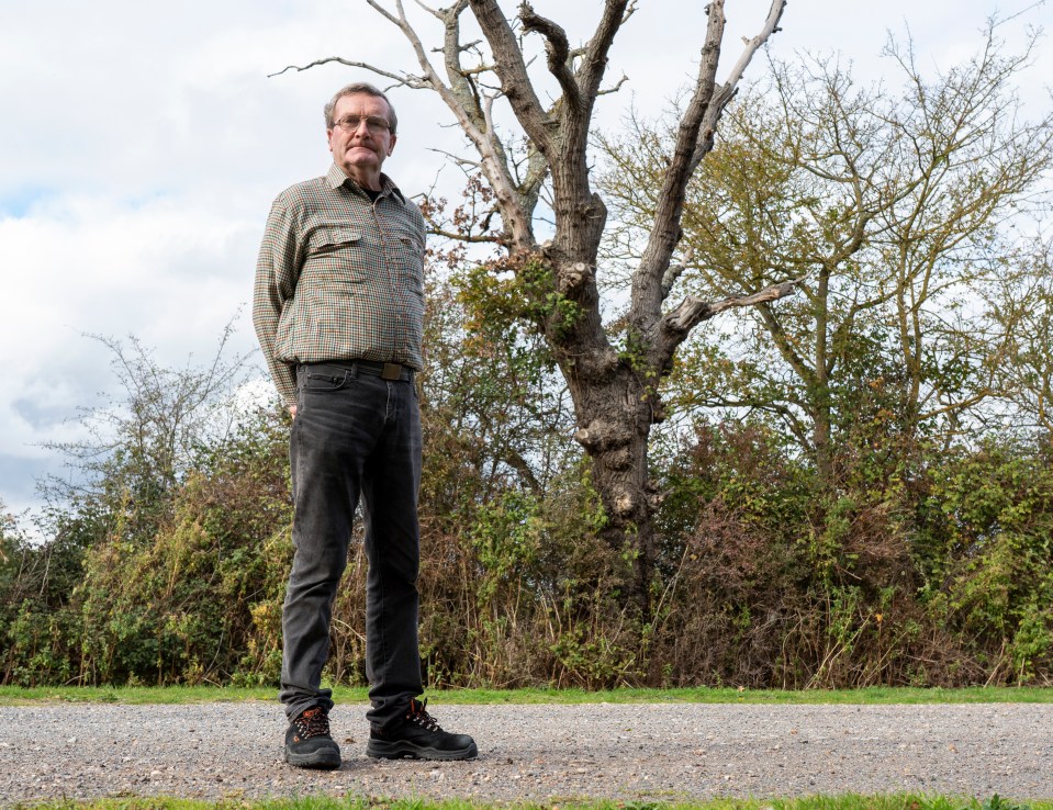 Joshua Saunders with a notebook and Peter Theobald, former farmer and co-founder of Living Memory Memorial.