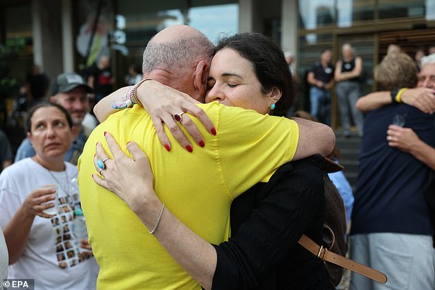 Itzik Horn, father of kidnapped Eitan Horn (L), celebrates after a peace deal is announced at Hostages Square in Tel Aviv, Israel, October 9, 2025