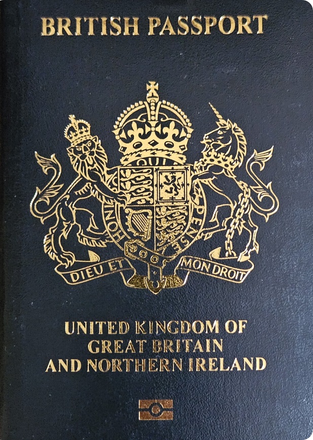 British passport featuring King Charles III's Coat of Arms.