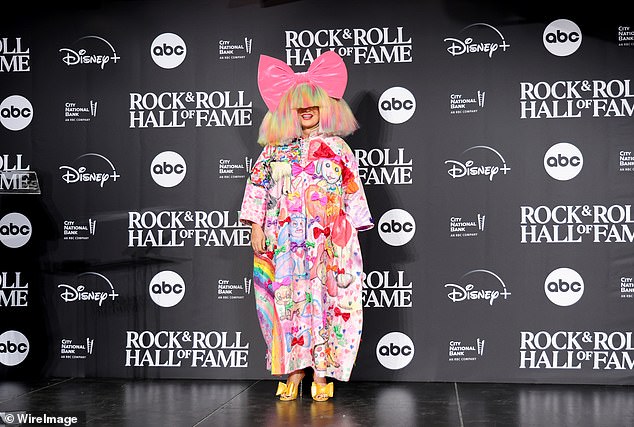 Sia is known for hiding her face with wigs; seen in 2023 in NYC