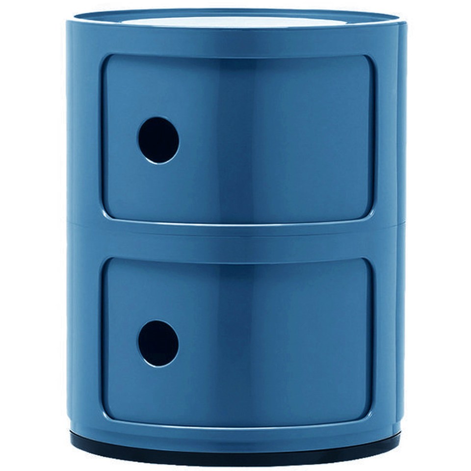 Blue round beside table with two drawers.
