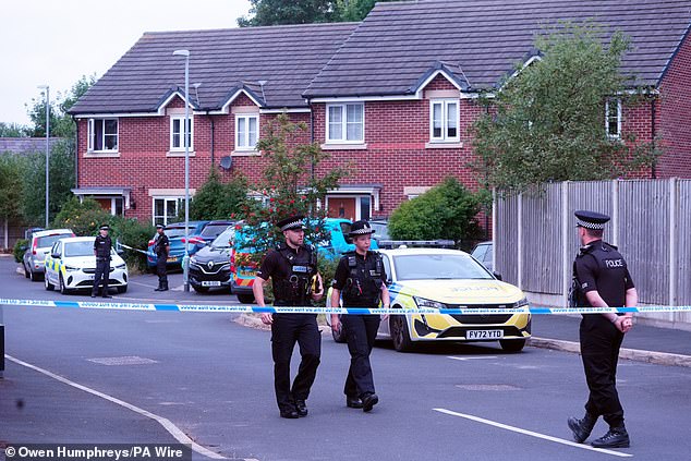 Police officers near the now 19-year-old's home in Old School Close, Banks, Southport