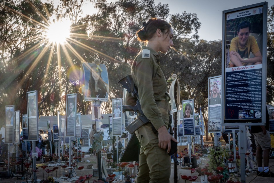 Israeli soldier Alma Shahaf mourns at a memorial for a friend killed at the Nova festival.