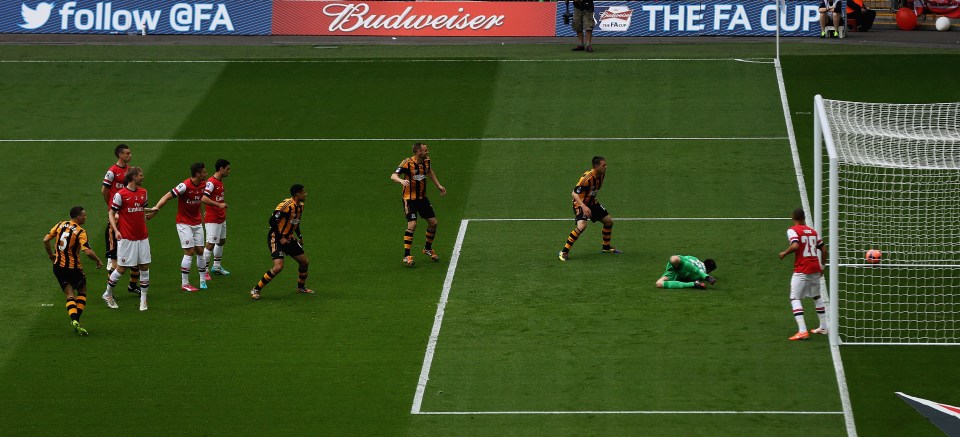 Hull City player James Chester scores the first goal during an FA Cup Final match against Arsenal at Wembley Stadium.
