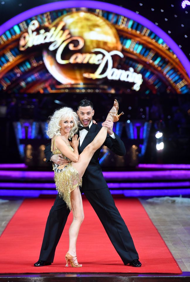 Debbie McGee and Giovanni Pernice performing a dance move from Strictly Come Dancing.