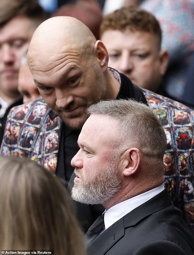 Tyson Fury and former footballer Wayne Rooney arrive to attend the funeral on Friday morning