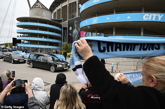 Ricky Hatton's hearse arrives at the Etihad Stadium on Friday afternoon following the funeral