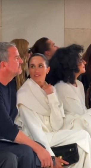 Markle's friend refused to make eye contact with Markle, silently shaking his head and appearing to say 'no' — in effect, telling her, 'We don't do that here.'