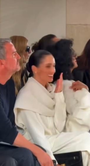 At Balenciaga, Meghan was caught laughing at a model who tripped on the runway