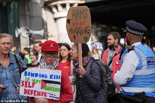 Pro-Palestine protesters gather in central London on Saturday afternoon as they march towards Whitehall