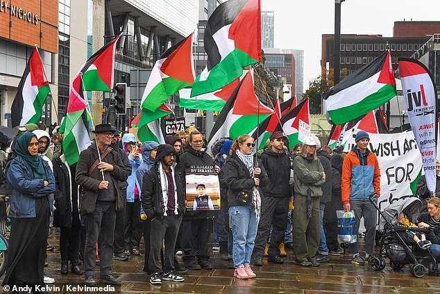 In Manchester, between 50 and 100 people turned out in the rain to protest in Manchester on October 4