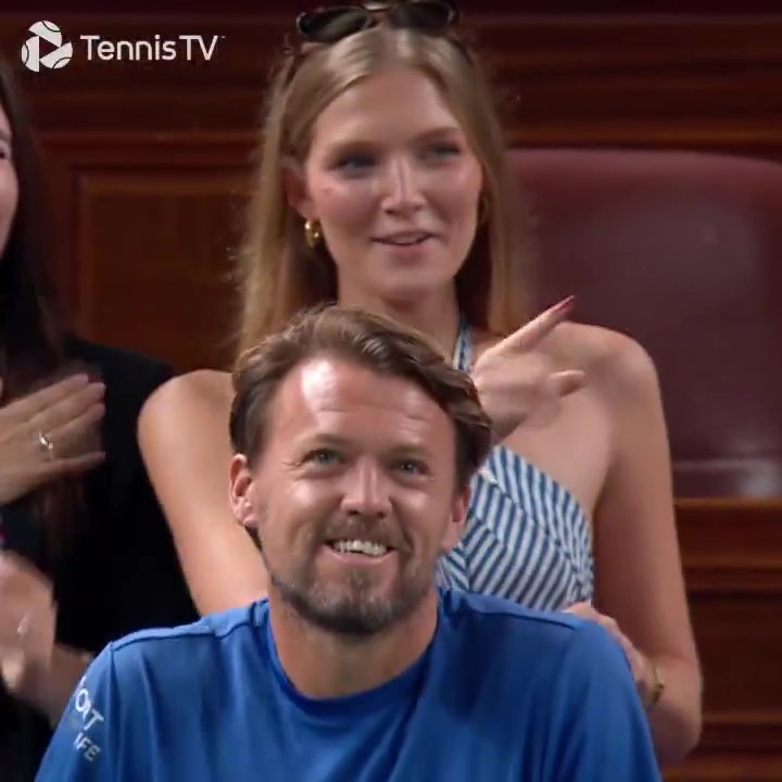 Valentin Vacherot watches Novak Djokovic on a screen.