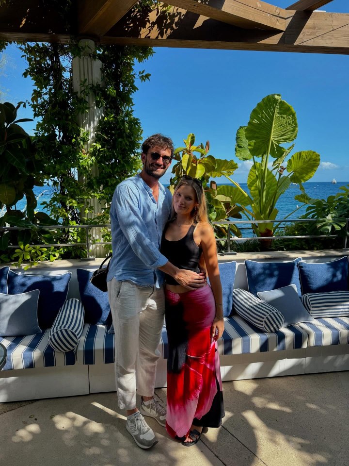 Valentin Vacherot and Emily Snyder standing together outdoors by the ocean.