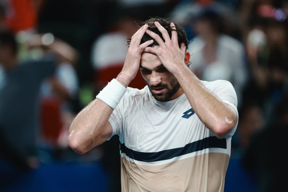 Valentin Vacherot of Monaco with his hands on his head, celebrating his win.