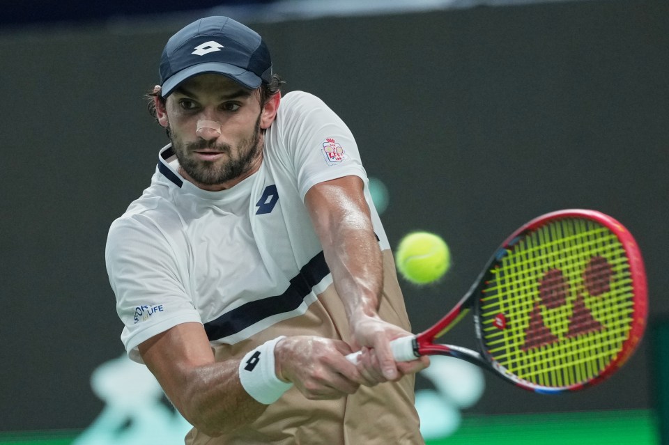 Valentin Vacherot of Monaco playing a backhand return.