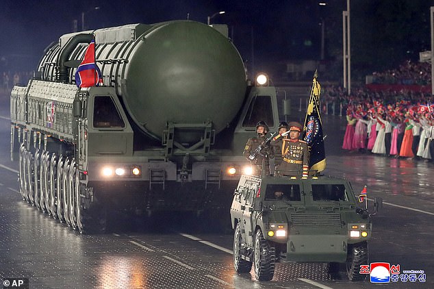 This photo provided by North Korean government shows what it says a new intercontinental ballistic missile called the Hwasong-20, during a military parade marking the 80th anniversary of the founding of the ruling Worker's Party