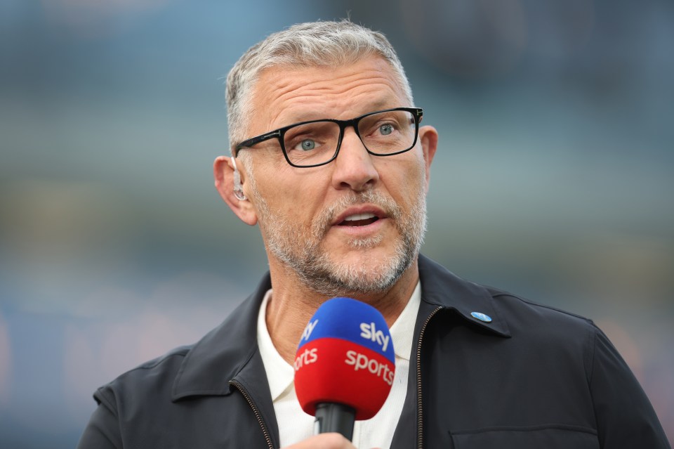 Sky Sports presenter Barrie McDermott speaking into a microphone.