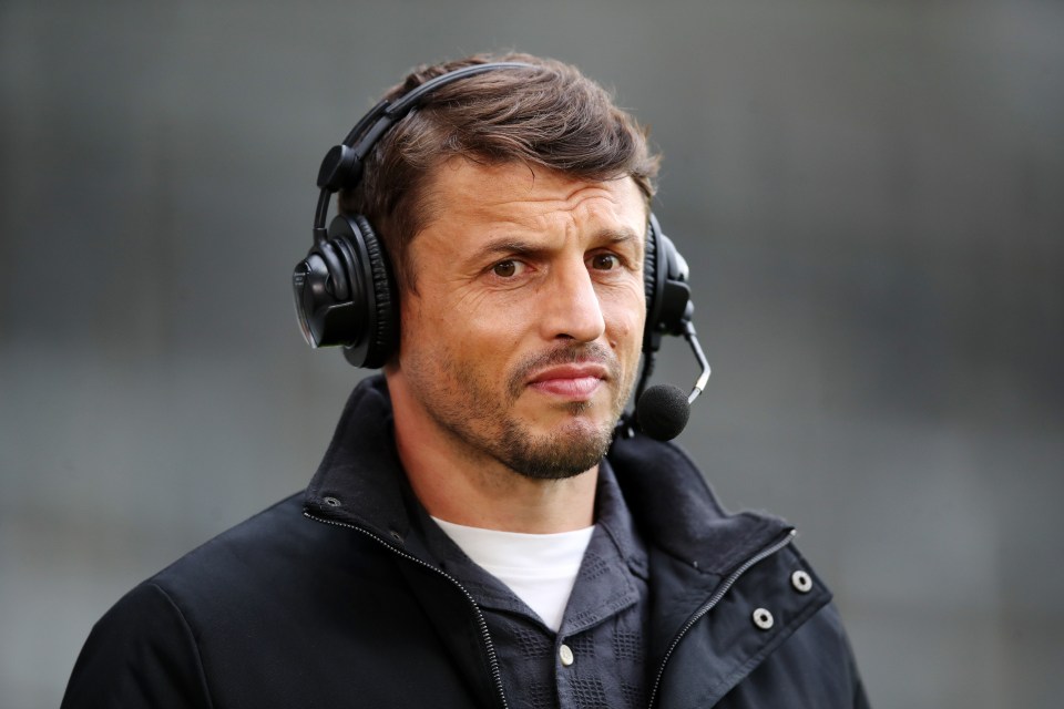 Jon Wilkin, Sky Sports Pundit, wearing headphones with a microphone.