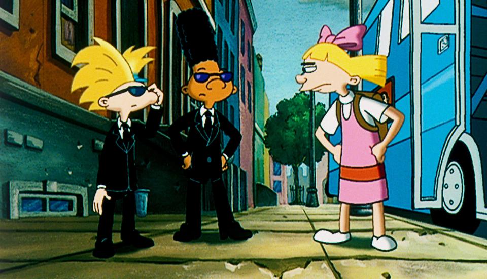 Illustration of Arnold and Gerald in black suits and sunglasses, looking at an angry Helga.