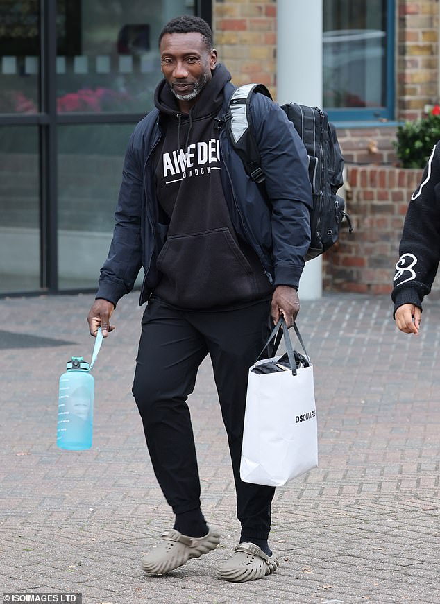 Jimmy Floyd Hasselbaink wore a casual black hoodie and joggers