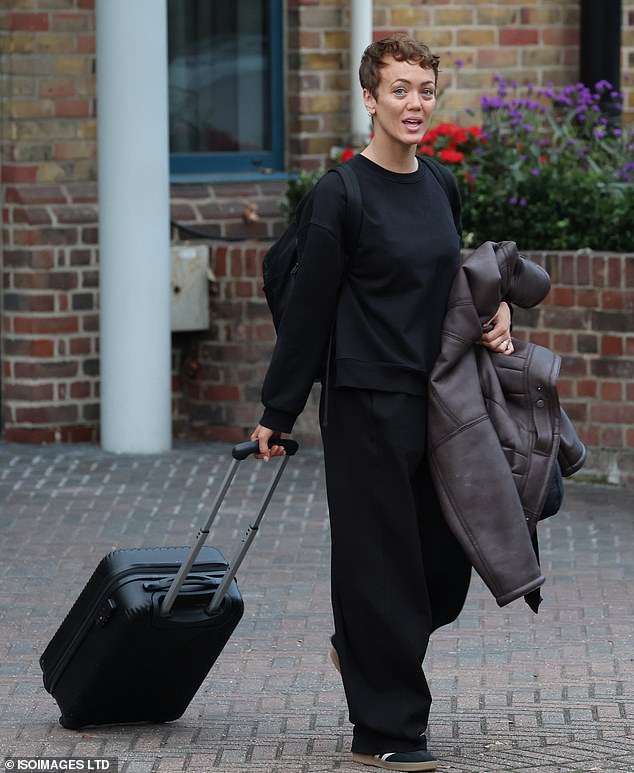 Lauren Oakley pulled her suitcase behind her as she left for the studio