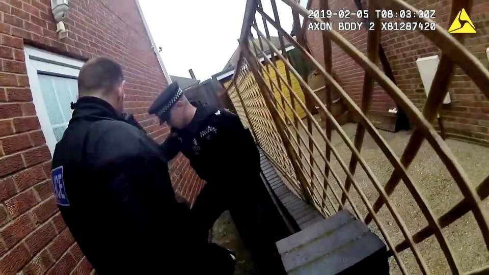 Police bodycam footage of officers entering Bob White's home.