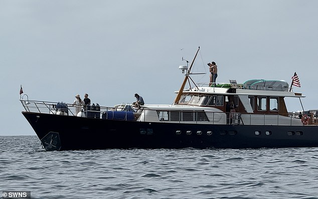 '[Perry] pulled up her boat next to a small public whale-watching boat, then they started making out,' said a passenger on a passing tourist boat