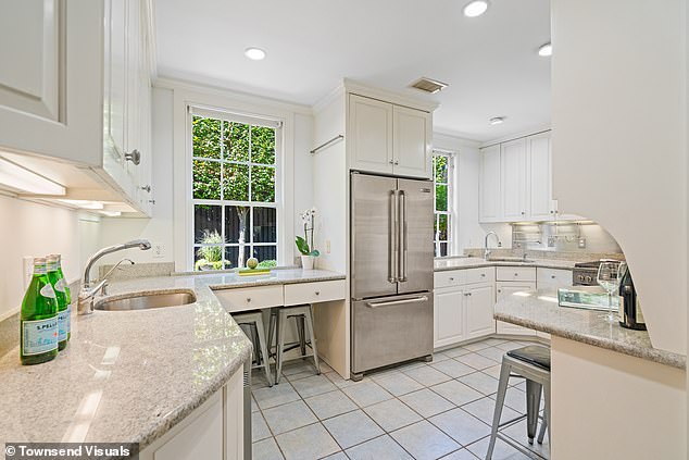 The kitchen has marble countertops and plenty of space