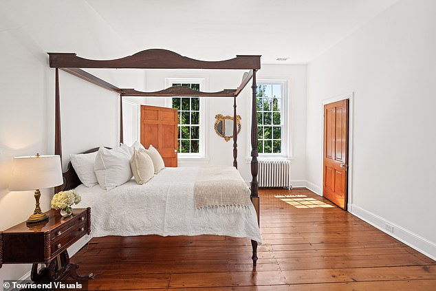 The red-brick home consists of three floors, five bedrooms and five and a half bathrooms