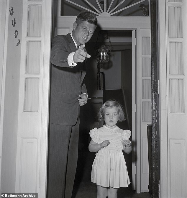 JFK at the home with his daughter, Caroline, in 1960 after returning from Thanksgiving in Florida