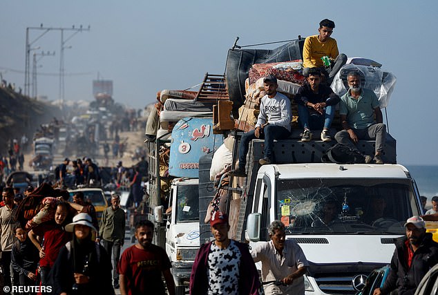 Hamas has until midday tomorrow local time to return the bodies along with 20 living hostages as part of the agreement for the first phase of the peace plan. Pictured: Palestinians make their way along a road as they return to the north
