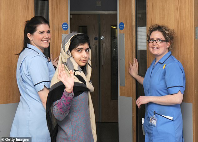 Malala pictured in 2013 at Queen Elizabeth Hospital in Birmingham, where she was provided with specialist treatment for her injuries