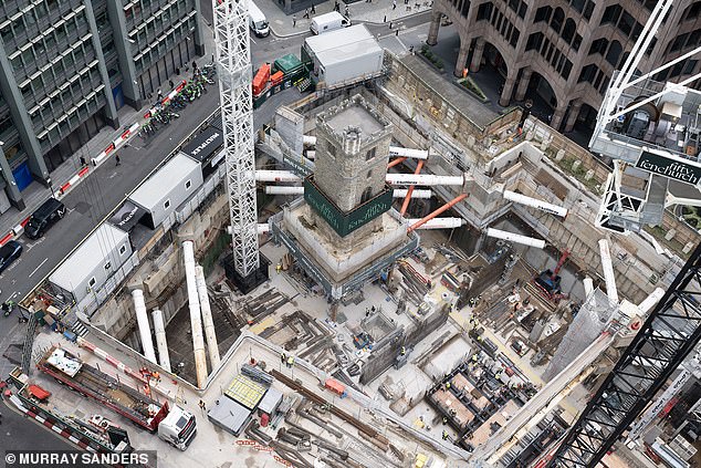 The 700-tonne stone tower is ¿floating¿, about 17 metres  above a vast £1billion construction site called Fifty Fenchurch