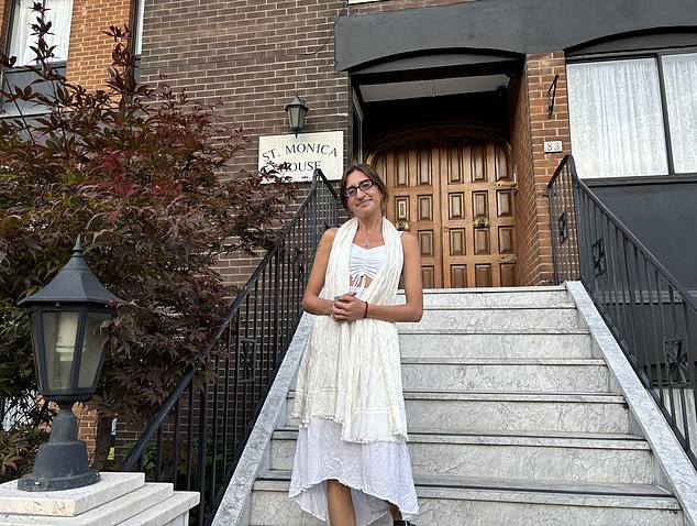 Stella standing in front of St Monica House in Clapham, a guest house and convent run by the Augustinian nuns