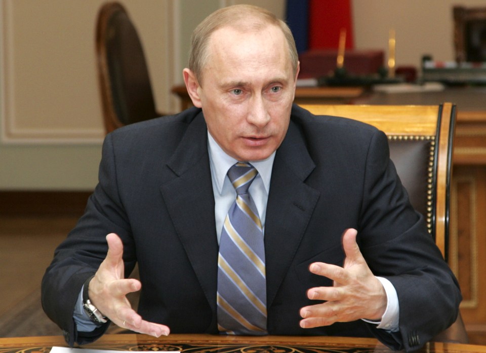Russian President Vladimir Putin speaking at a meeting.