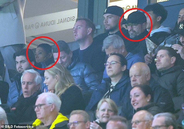 Jude's parents Denise (top left) and Mark (top, second from right in a cap) were seen sitting apart at brother Jobe's match for Borussia Dortmund last week