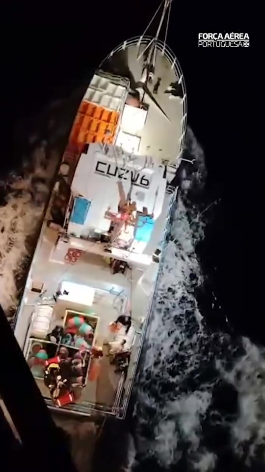 Overhead view of a vessel at sea at night.