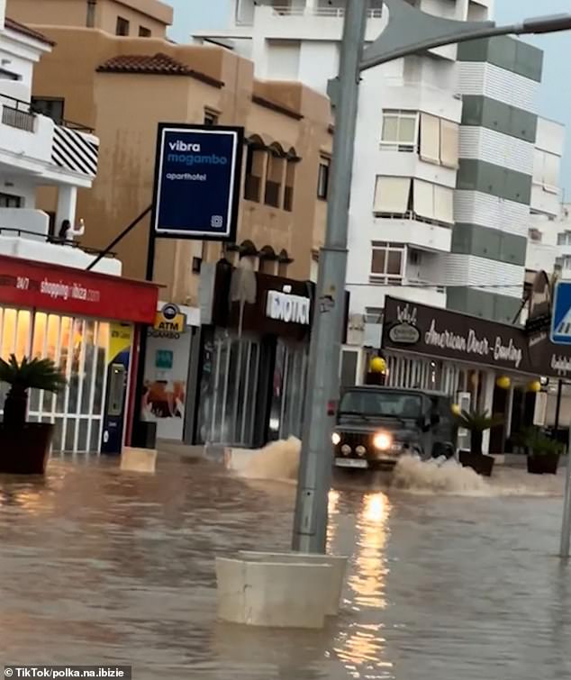 Larger cars struggled to travel down the streets which were covered by the massive deluge