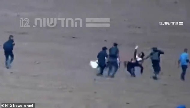 Hostage Amit Soussana is seen fighting Hamas gunmen as they abducted her on October 7, 2023