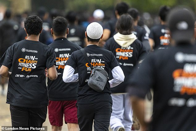 Runners take part in the Muslim Charity Run in Victoria Park, east London, in this year's event