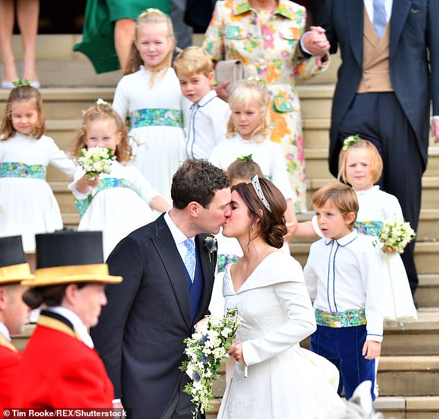 Eugenie and Jack share a kiss outside the chapel. The couple now have two young sons and live in Ivy Cottage
